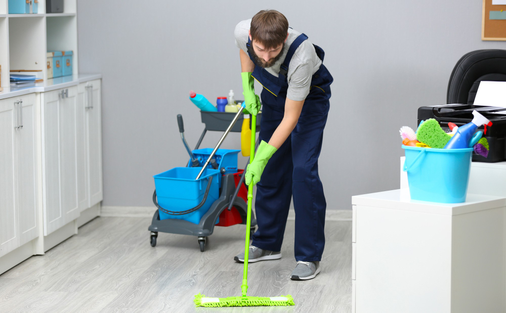 Industrial floor cleaning machine polishing a large commercial space